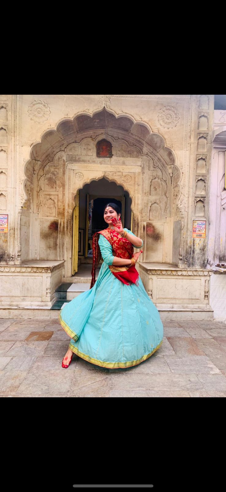 Surbhi at a heritage Jaipur archway in classical attire