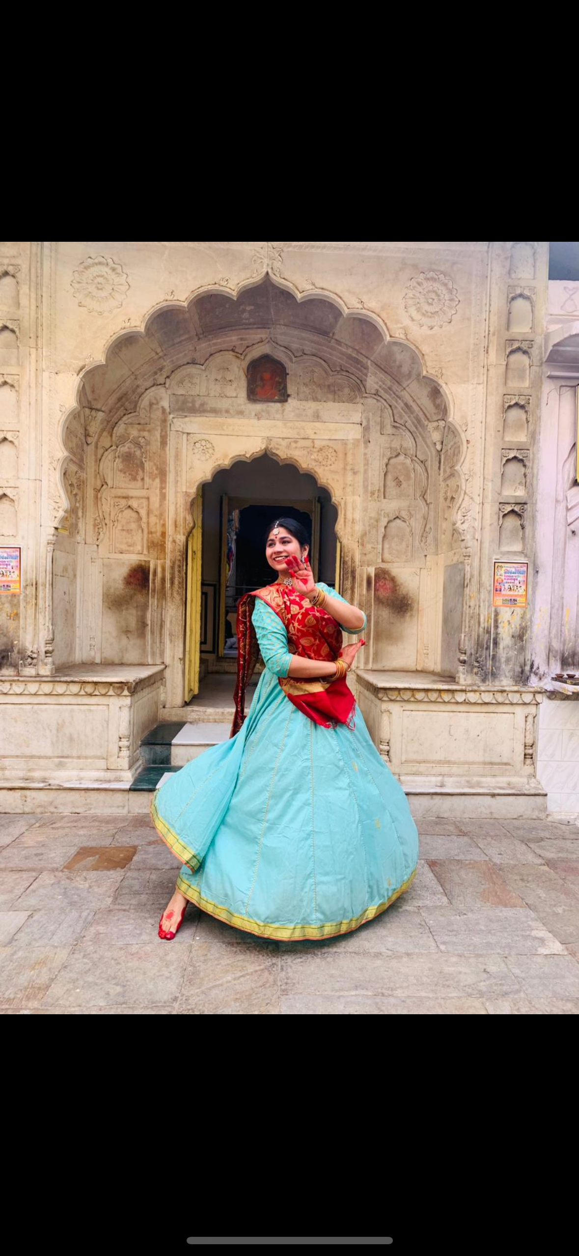 Surbhi at a heritage Jaipur archway in classical attire